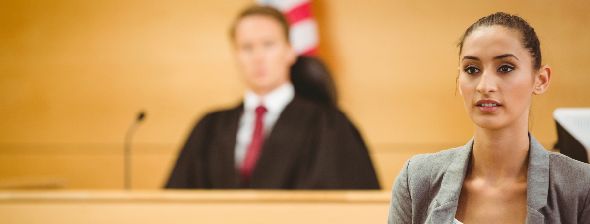 Woman standing in front of a judge